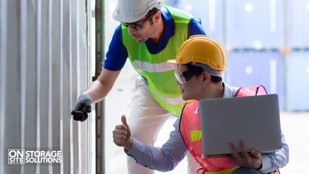 Customer checking cargo container door seals and flooring upon delivery