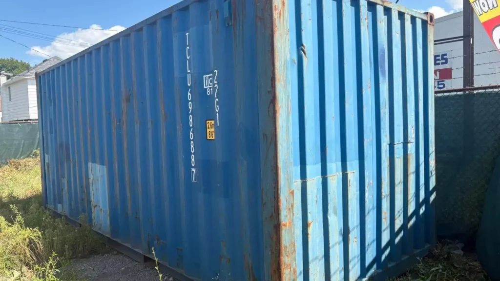 Summary image showing anchored shipping container