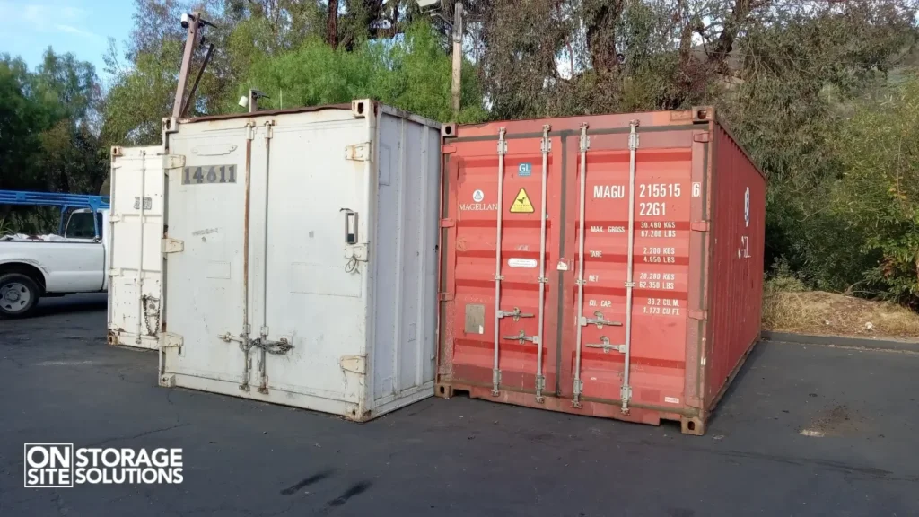 used shipping containers side by side with visible color and wear differences