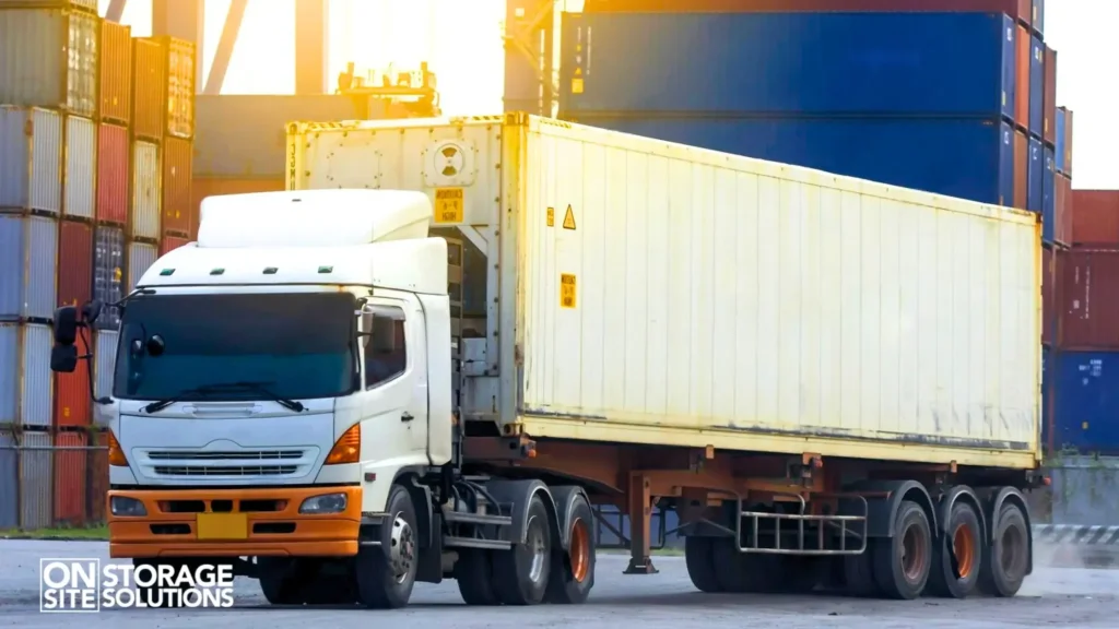 Container transport USA truck moving a shipping container for commercial logistics operations.